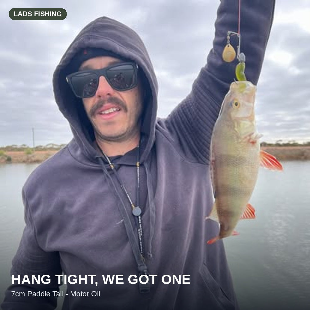 Hang tight, we got one — caught on the Motor Oil 7cm Paddle Tail